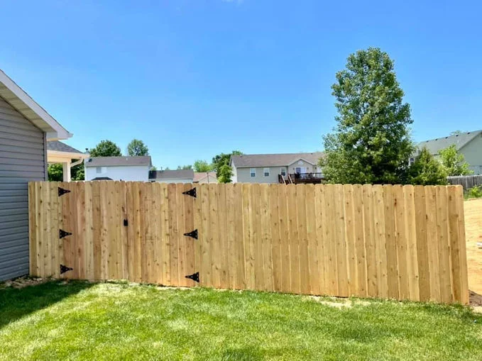 Wooden fence near house in the backyard