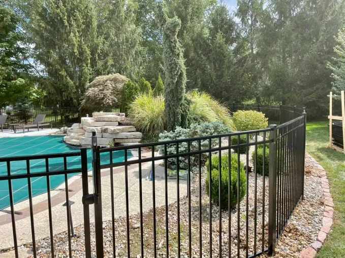Black aluminum fence in the garden.