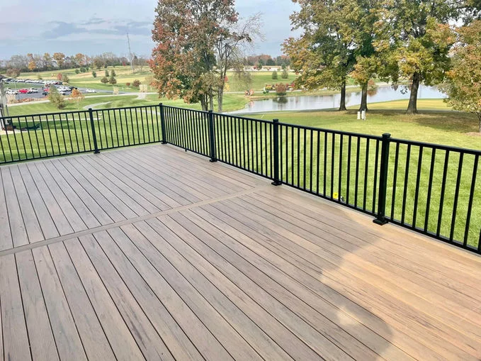 Wooden deck with black aluminum fence.