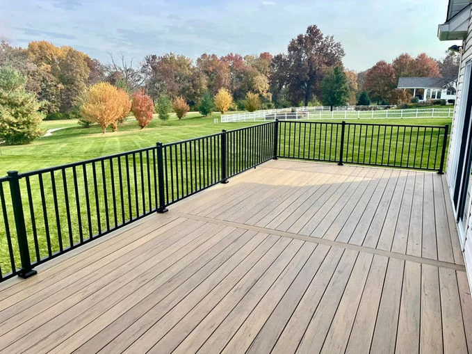 Wooden deck with black aluminum fence.
