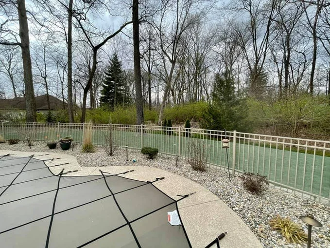 Grey aluminum backyard fence
