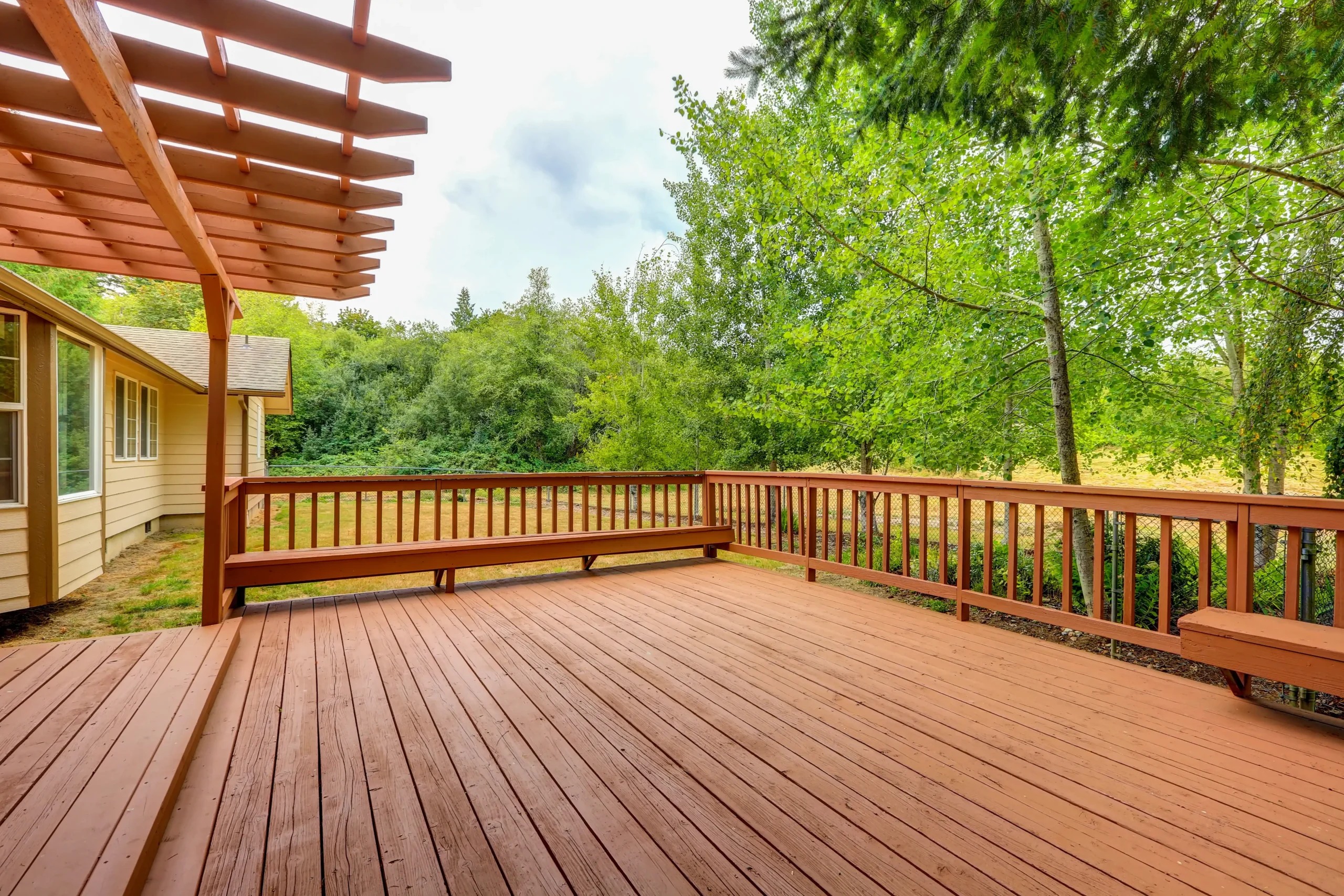 Wooden deck with wood fencing.